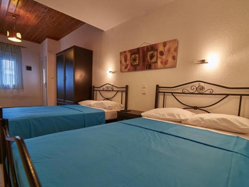 Ein Bett oder Betten in einem Zimmer der Unterkunft Toroni Dreams