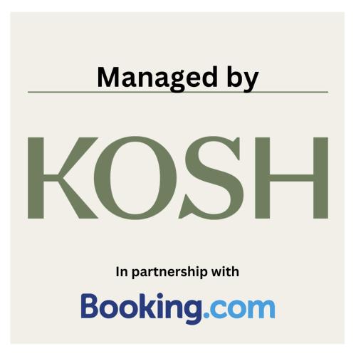 a sign that reads klost in partnership withboarding at Harbour Haven - A Sunset Oasis! - By KOSH BNB in Tauranga