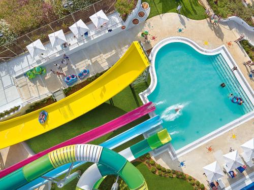 an overhead view of a water slide at a water park at Grecotel Marine Palace & Aqua Park in Panormos Rethymno