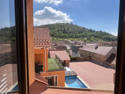 a view from a window of a building with a swimming pool at Pension Mikulov in Mikulov