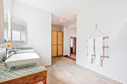 a bathroom with a sink and a mirror at C Rodrigues Mourouk in Rodrigues Island