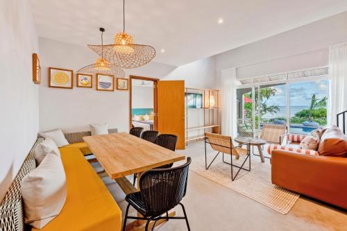 a living room with a table and a couch at C Rodrigues Mourouk in Rodrigues Island
