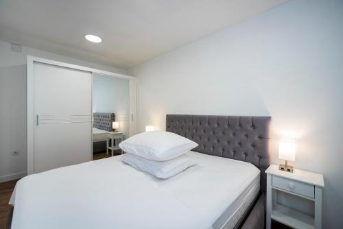 Posteľ alebo postele v izbe v ubytovaní M&M Pelivan apartments
