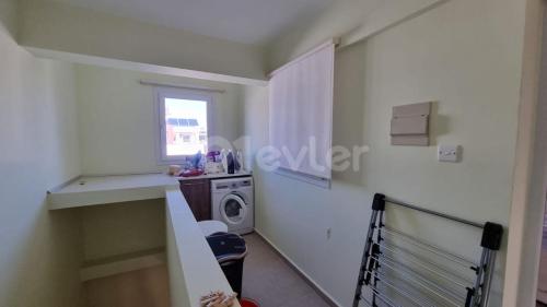 a room with a sink and a washing machine at Sunny Pearl of Cyprus in İskele