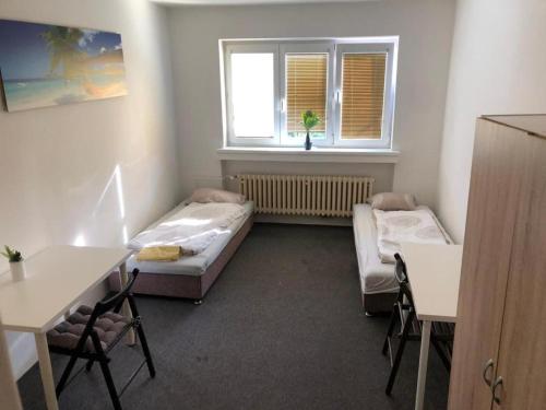 Ένα ή περισσότερα κρεβάτια σε δωμάτιο στο Hostel ROOM Vystaviste BVV