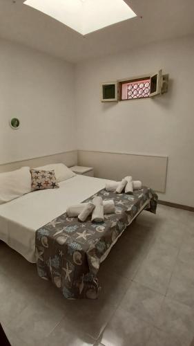 Postel nebo postele na pokoji v ubytování A 2 passi dalla piazza