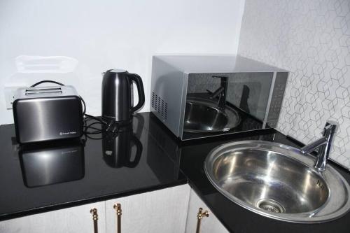 Kuchyň nebo kuchyňský kout v ubytování Block 10 La casa