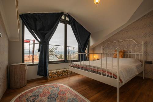 Postel nebo postele na pokoji v ubytování Penthouse in Fethiye