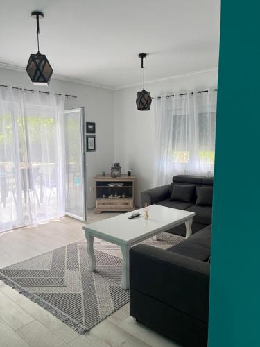 a living room with a couch and a table at Duos Rios in Mostar