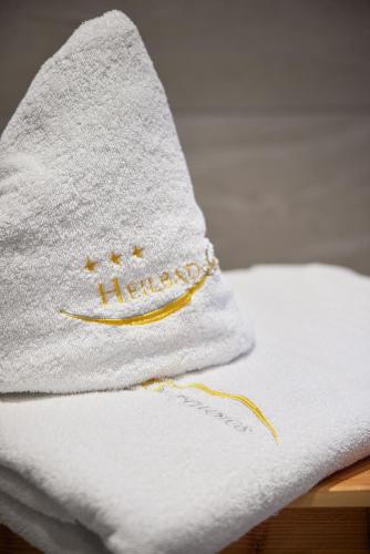 a towel sitting on top of a bed at Heilbad Burgwies in Stuhlfelden