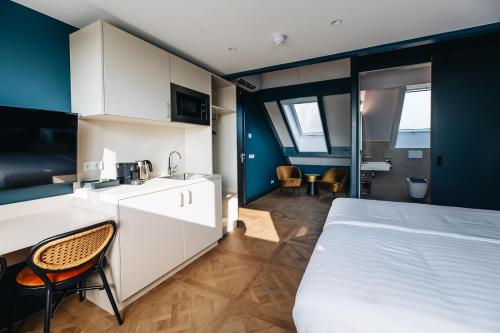Ένα ή περισσότερα κρεβάτια σε δωμάτιο στο Hotel Renesse