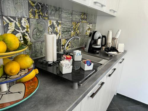 a kitchen with a counter with fruits on it at B&B La Chiave in Vietri sul Mare