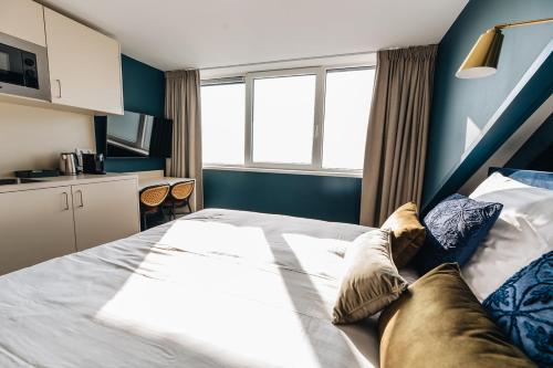 Ένα ή περισσότερα κρεβάτια σε δωμάτιο στο Hotel Renesse