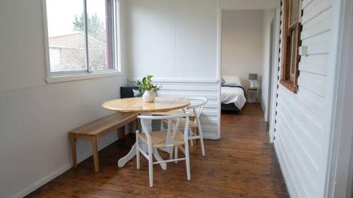 a dining room with a table and chairs in a room at East Albury home near hospital & sports precinct in Albury