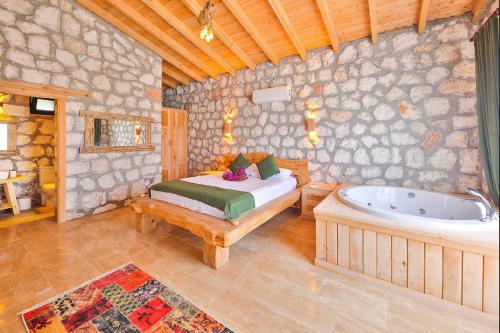 Ένα ή περισσότερα κρεβάτια σε δωμάτιο στο Begonvilla Stone