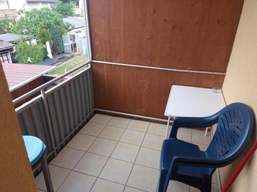 a small table and chairs in a room with a window at Hotel Victoria in Weil am Rhein