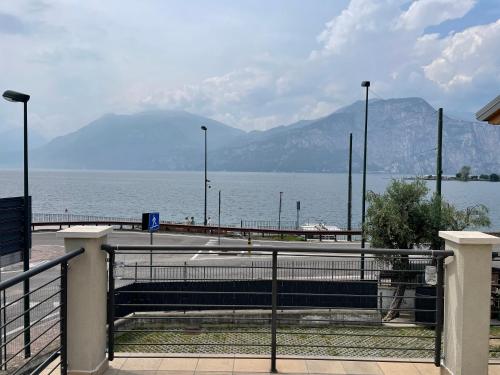 a view of a body of water with mountains at Camping Antonio in Brenzone sul Garda