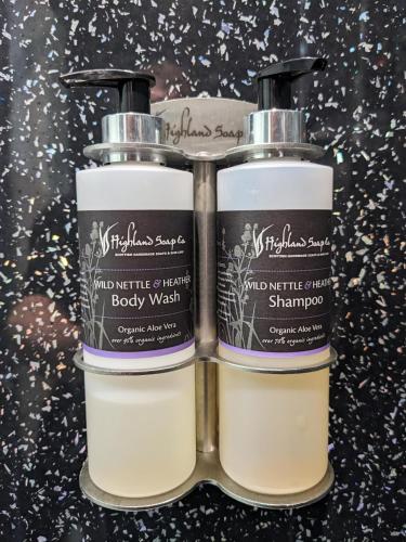 two bottles of soap sitting next to each other at Loch Ness Drumnadrochit Hotel in Drumnadrochit