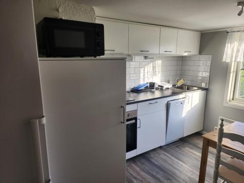 Kuchyň nebo kuchyňský kout v ubytování Stuga på landet