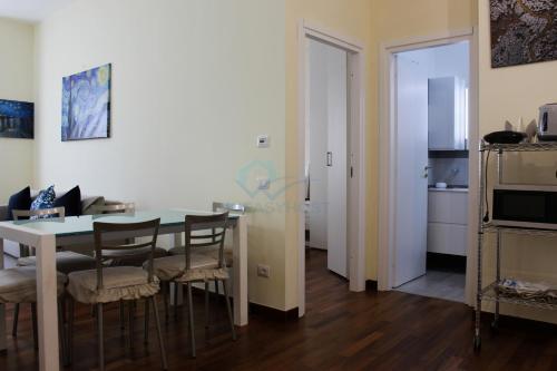 a kitchen and dining room with a table and chairs at Your Perfect Roman Getaway in Vatican in Rome