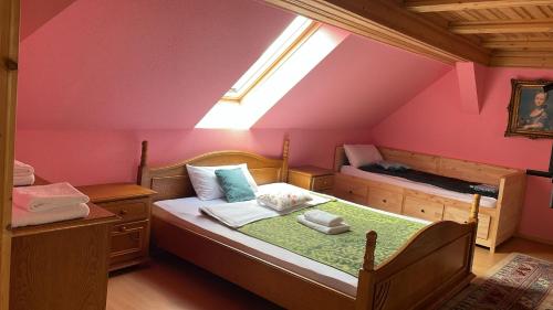 a small bedroom with a bed with a window at FreiNestWaldviertel in Hoheneich