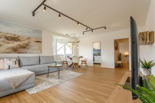 a living room with a couch and a table at Ferienwohnung Achim in Isny in Isny im Allgäu