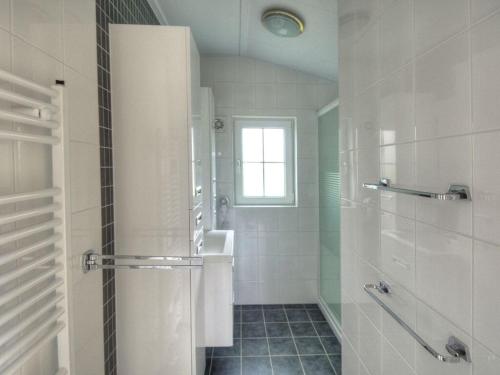 a bathroom with a shower and a sink at Holiday House 177 Seeadler "Sea Eagle" type in Fehmarn