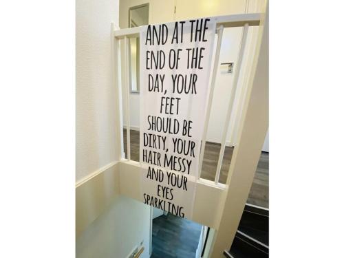 a stairway with a sign that reads and at the end of the day your at Sunhouse Makkum Beach in Makkum