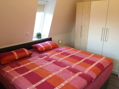 Ένα ή περισσότερα κρεβάτια σε δωμάτιο στο Holiday home for 4 people in Cuxhaven