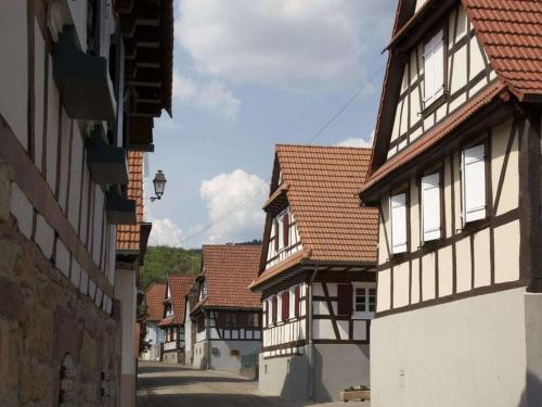 a row of buildings in a town with at Les Petits Vignerons in Cleebourg