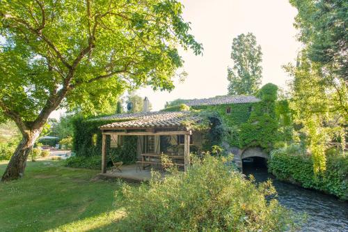 a house with a gazebo in a yard at La Cannara in Marta