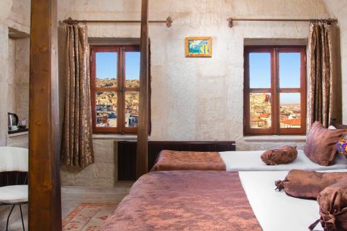 Postel nebo postele na pokoji v ubytování Romantic Cave Hotel