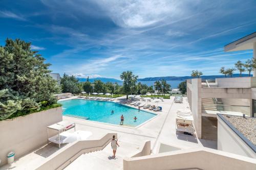 a view of the pool at a resort with people in it at Wyndham Grand Novi Vinodolski Resort in Novi Vinodolski