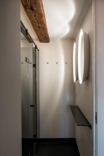 a bathroom with a shower and a glass shower stall at The Nyhavn Penthouse by Daniel&Jacob's in Copenhagen