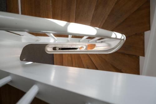 a cell phone sitting on top of a counter at The Nyhavn Penthouse by Daniel&Jacob's in Copenhagen