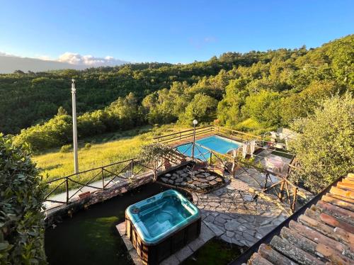 a small boat in a canal with a pool at Villa immersa nel verde in Spoleto