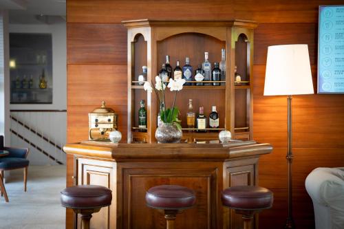 a bar with a bunch of bottles of wine at Melia Cala d'Or Boutique Hotel in Cala d´Or