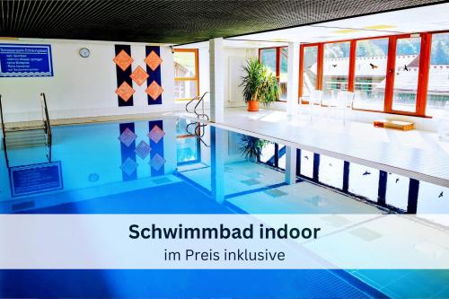 a swimming pool in a building at Black Forest Stay - Apartment Hirschperle in Sasbachwalden