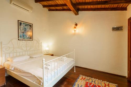 Ένα ή περισσότερα κρεβάτια σε δωμάτιο στο Ephesus Lodge