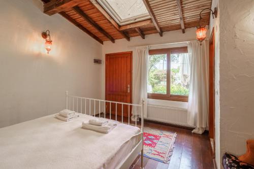 Ένα ή περισσότερα κρεβάτια σε δωμάτιο στο Ephesus Lodge