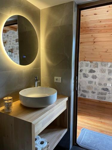 a bathroom with a sink and a shower at Valter & Drita's Guesthouse in Theth