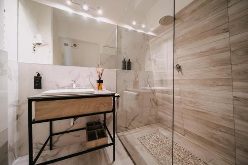 a bathroom with a sink and a shower at Hotel Lalla Beauty & Relax in Cesenatico