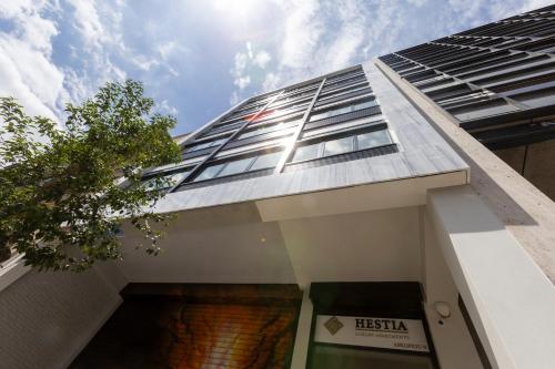 a facade of a building with the sky in the background at Hestia - Asklipiou 9 in Athens