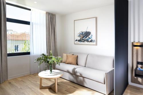 a living room with a couch and a table at Hestia - Asklipiou 9 in Athens