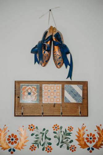 a wooden shelf with tiles on a wall at Hotel Casa Alquimia in Quito