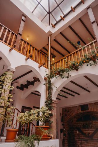 a building with a staircase with plants on it at Hotel Casa Alquimia in Quito