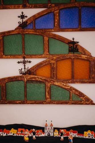 a group of glass windows with a train on them at Hotel Casa Alquimia in Quito