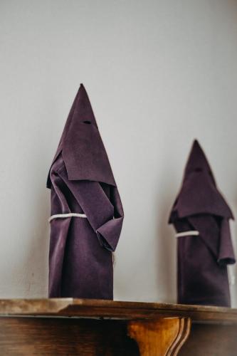 two napkin puppets are sitting on a table at Hotel Casa Alquimia in Quito