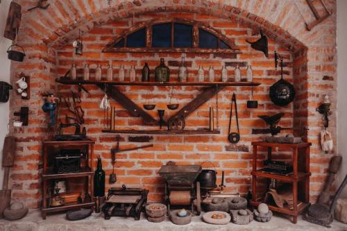 a brick wall with shelves and a brick oven at Hotel Casa Alquimia in Quito