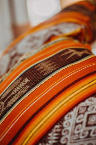 a close up of an orange and brown tie at Hotel Casa Alquimia in Quito